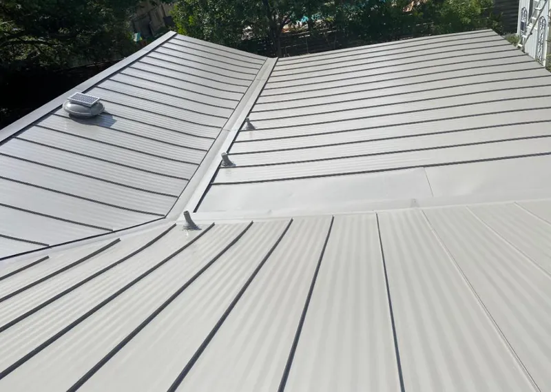 Solar attic fan installed on a metal roof for Roof Ventilation in Fort Bragg